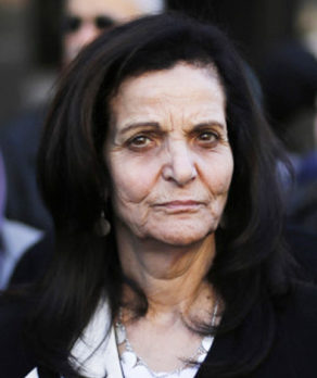 Rasmea Odeh listens to supporters after leaving federal court in Detroit Thursday, March 12, 2015. A judge sentenced the Chicago activist to 18 months in federal prison Thursday for failing to disclose her convictions for bombings in Israel when she applied to be a U.S. citizen. Odeh, 67, also was stripped of her citizenship and eventually will be deported. But she will remain free while she appeals the case. (AP Photo/Paul Sancya)