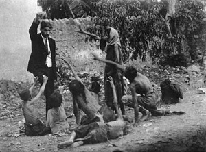 Turk_official_teasing_Armenian_starved_children_by_showing_bread,_1915_(Collection_of_St._Lazar_Mkhitarian_Congregation)
