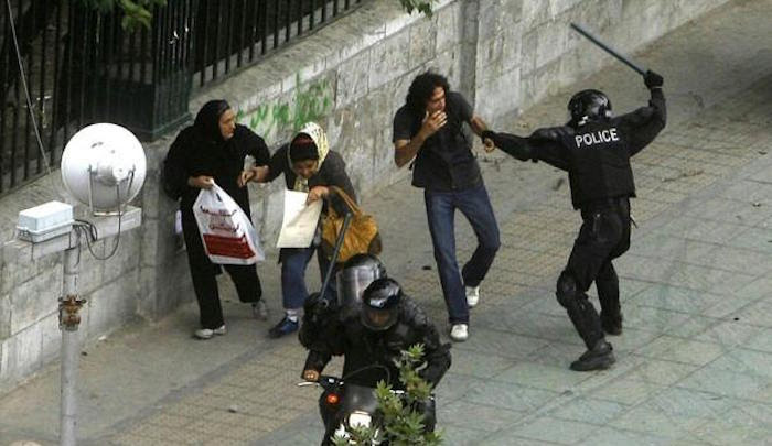 iran police beat citizens