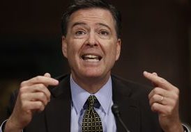 FBI Director James Comey testifying before Congress.