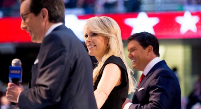 Fox News moderators from left, Chris Wallace, Megyn Kelly and Bret Baier warm up the crowd before Republican presidential candidates New Jersey Gov. Chris Christie, Sen. Marco Rubio, R-Fla., Ben Carson, Wisconsin Gov. Scott Walker, Donald Trump, former Florida Gov. Jeb Bush, former Arkansas Gov. Mike Huckabee, Sen. Ted Cruz, R-Texas, Sen. Rand Paul, R-Ky., and Ohio Gov. John Kasich take the stage for the first Republican presidential debate at the Quicken Loans Arena, Thursday, Aug. 6, 2015,  in Cleveland. (AP Photo/Andrew Harnik)